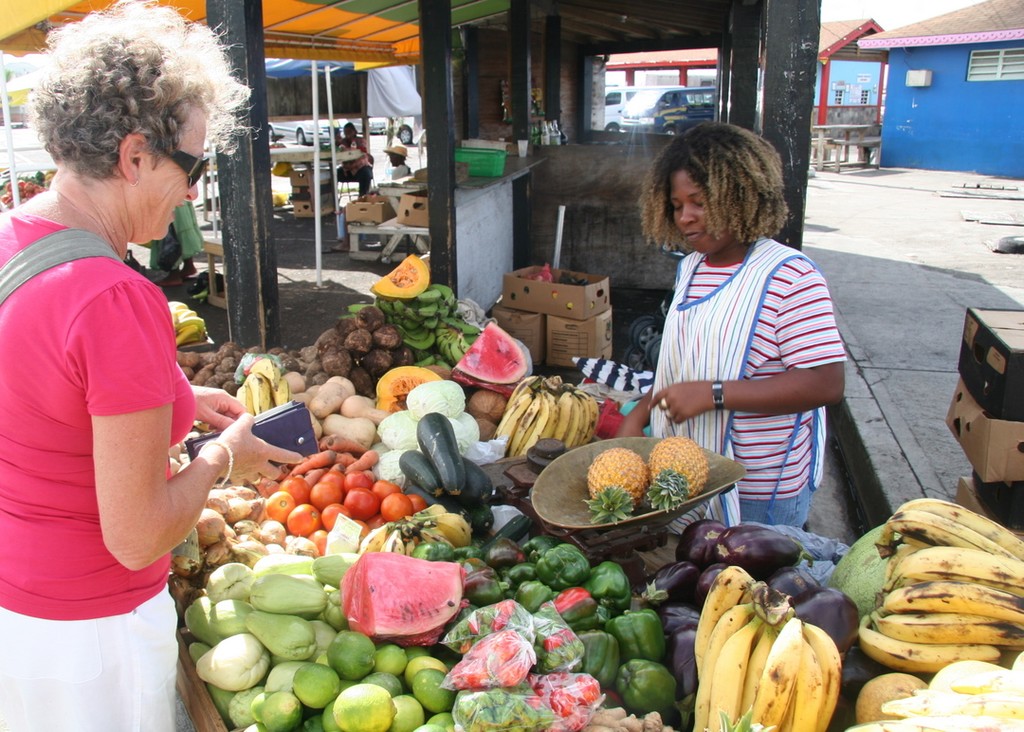 Purchasing fruits from lacal stall, Nevis © Maggie Joyce - Mariner Boating Holidays http://www.marinerboating.com.au
